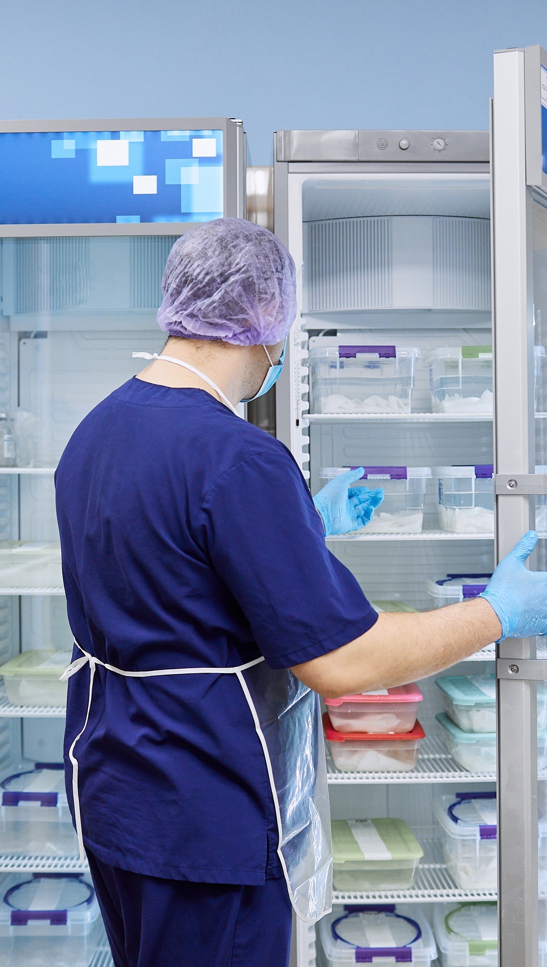 Doctor with medical refrigerator